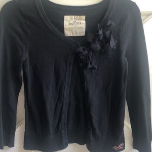 Gently worn vintage Hollister California navy blue cardigan. Lace bows on collar